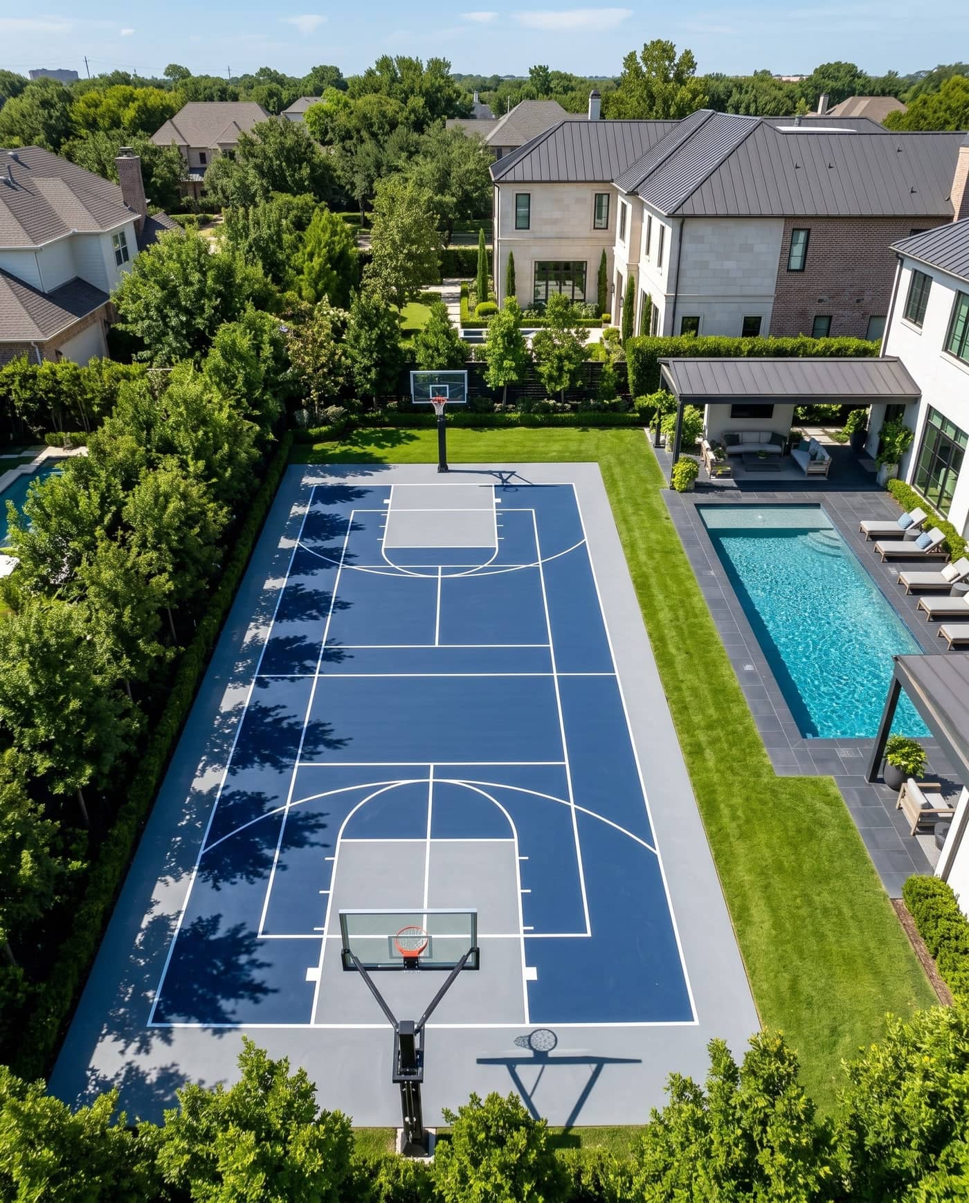 Top-down view of a navy and gray multi-use court beside a lawn
